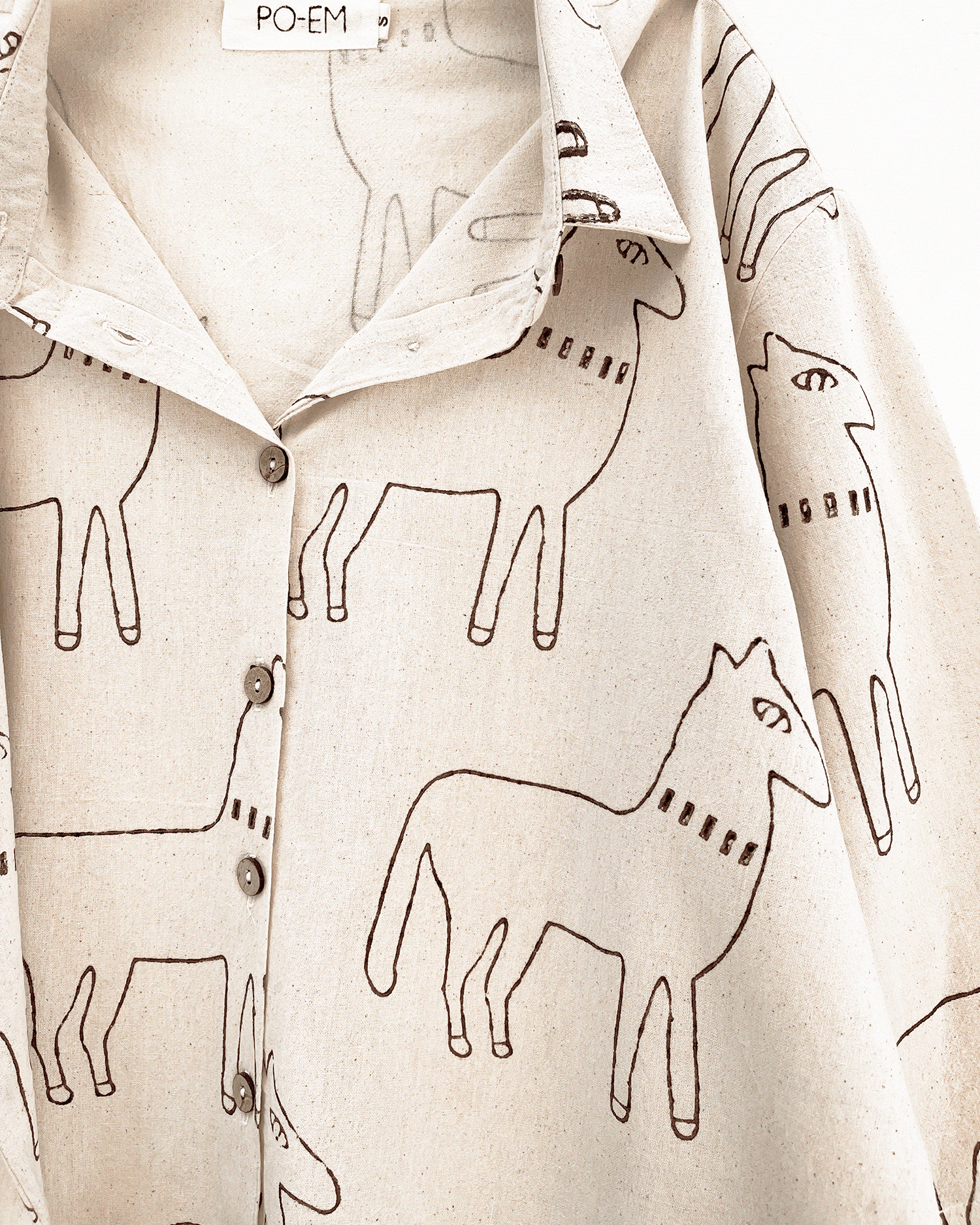 Handmade cotton button down shirt with a horse block-print pattern fabric.