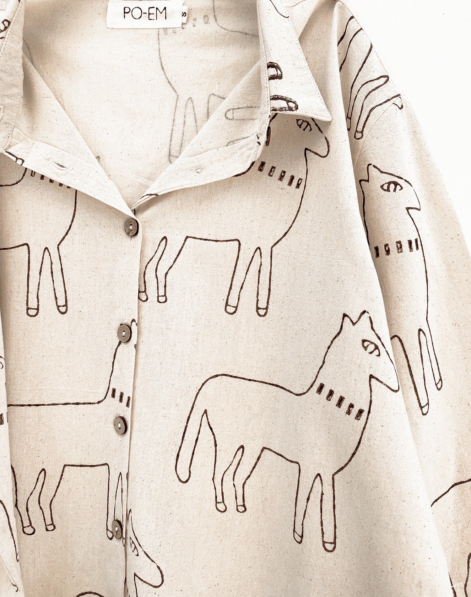 Handmade cotton button down shirt with a horse block-print pattern fabric.