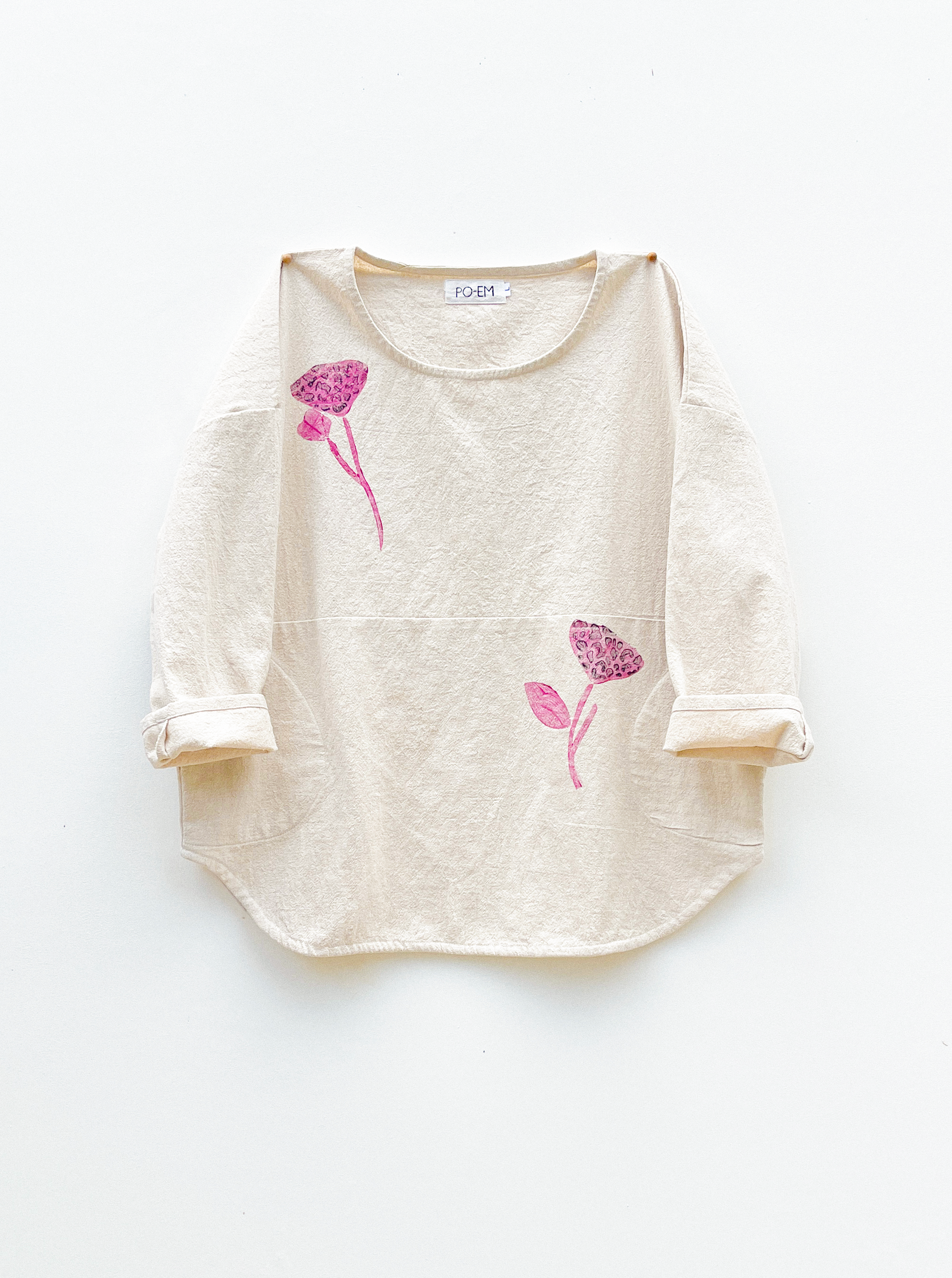 PO-EM Cotton Beige long-sleeve shirt with pink floral designs on a white background