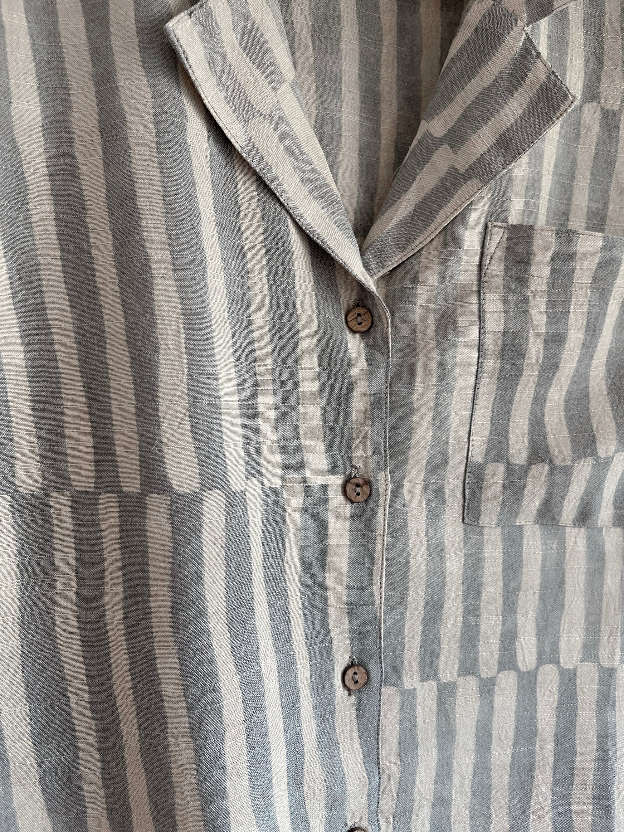 Striped shirt with a collar and buttons on a plain background by PO-EM