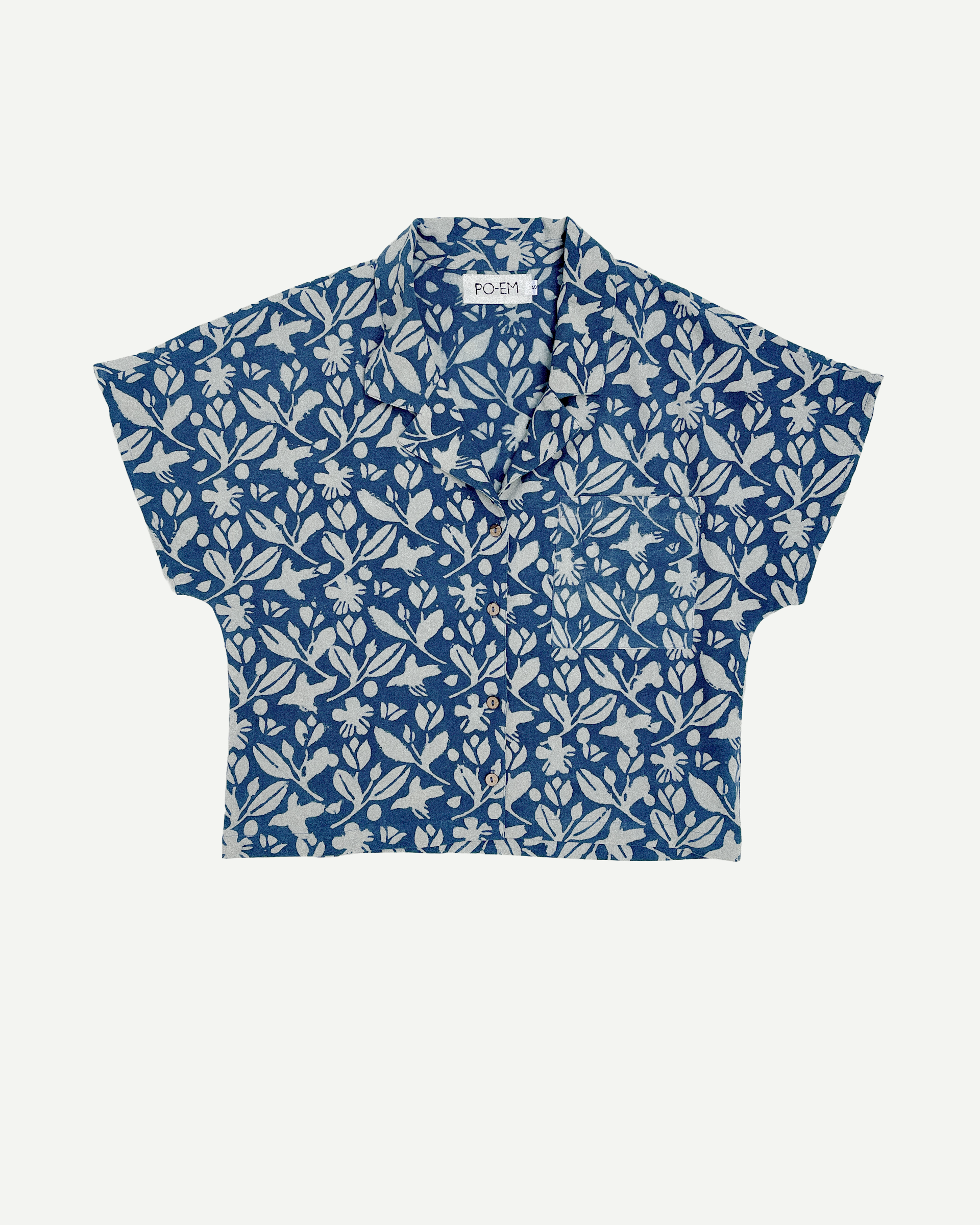 Blue floral patterned shirt on a white background