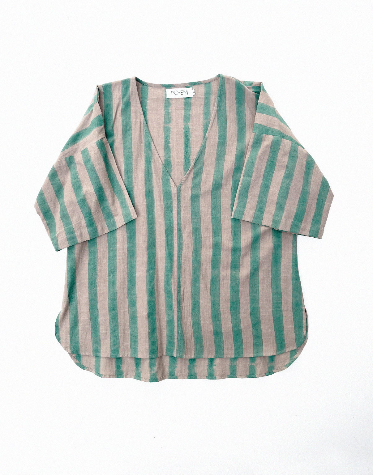 A handmade block-printed tunic top with green and tan striped by PO-EM. 